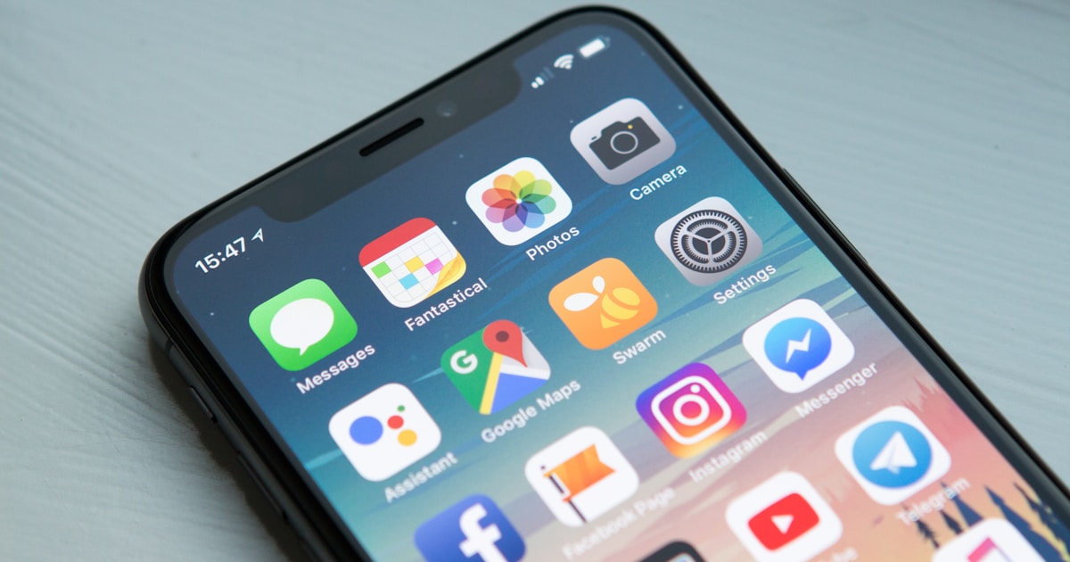 Person setting up a new Australian mobile phone SIM card after arriving in Australia