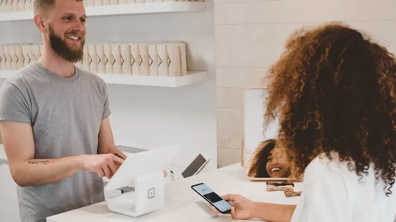 Person managing finances on phone, building credit in Australia