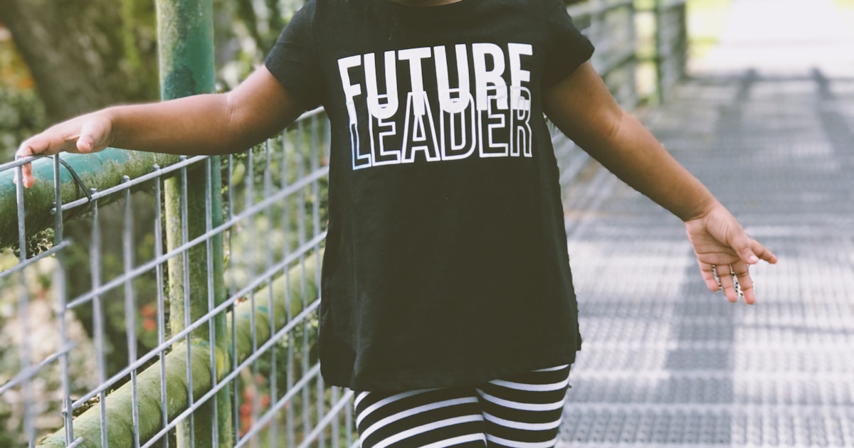 Australian family with children at a park showing cost of family life in Australia
